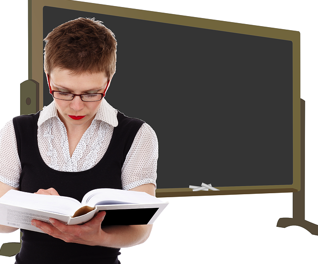 Photo: Teacher with book in classroom