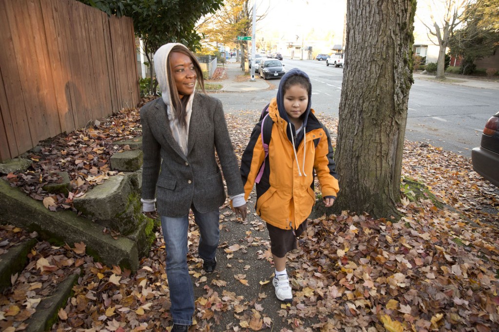 Andrea walks Zoe to school.