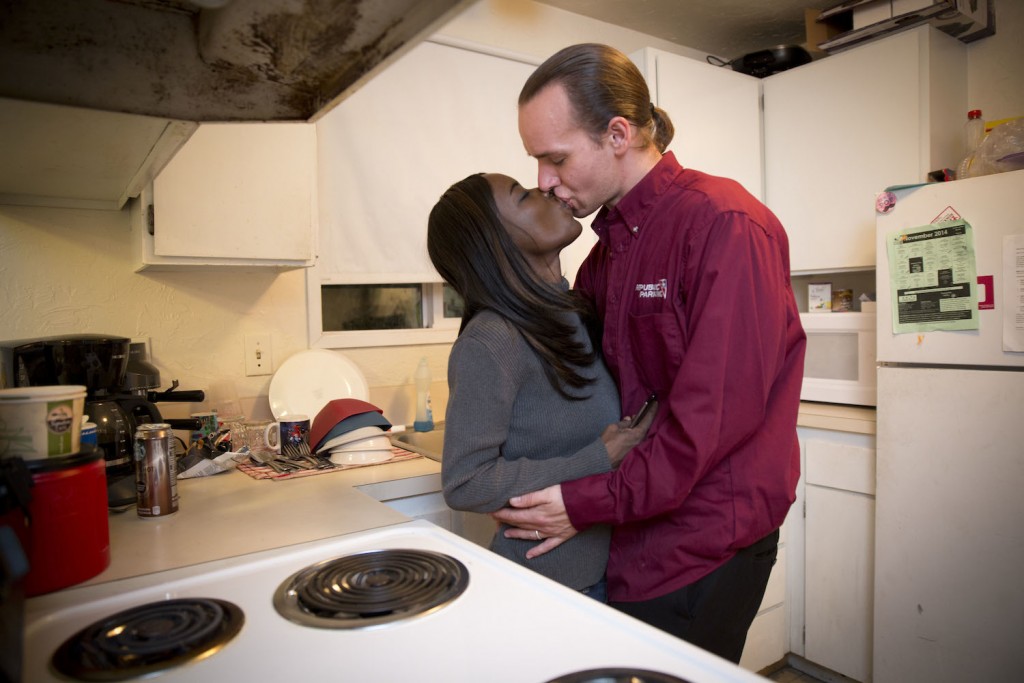 At the end of the workday, Lawrence arrives home and connects with his wife.