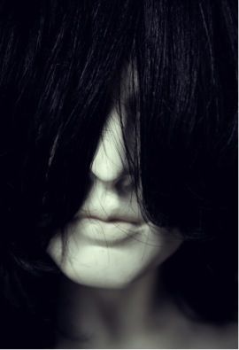 Image 4. Woman's face covered by hair